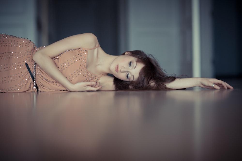 a beautiful women lying on the floor