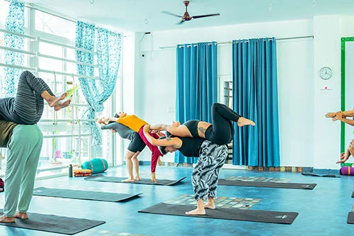 Advanced yoga pose practice by students